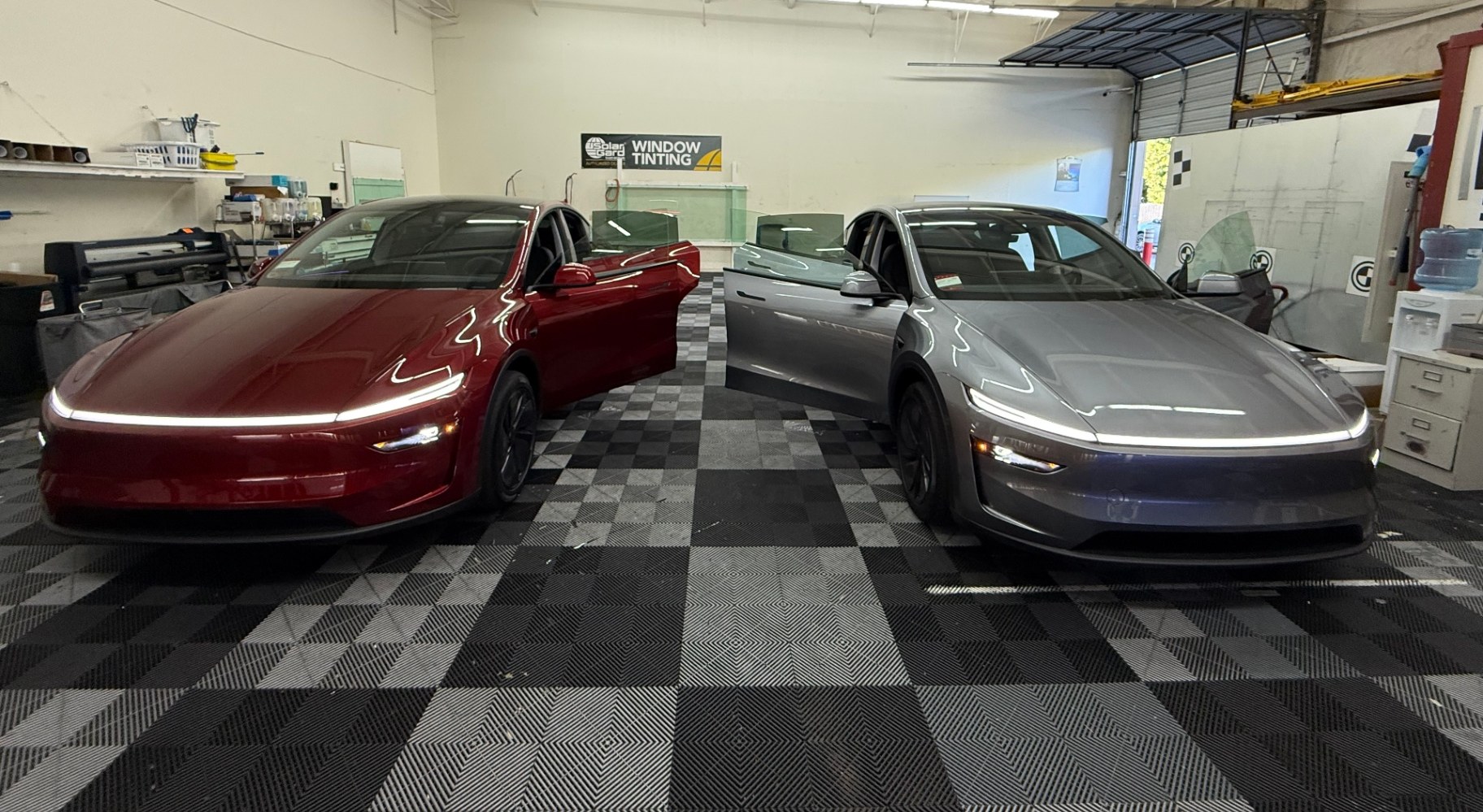 Tesla vehicles in the Low Price Auto Glass service bay in Dublin, California